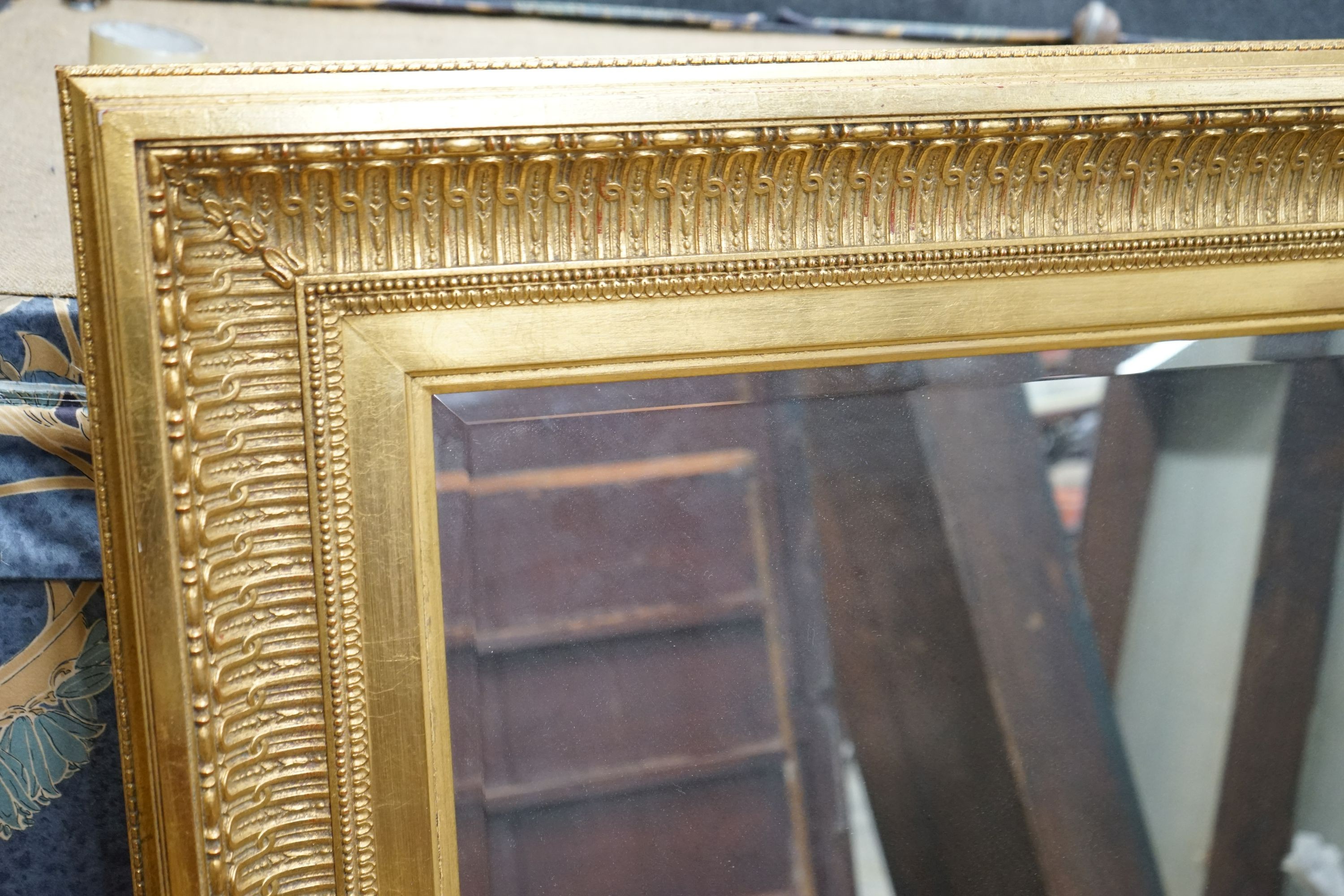 A large reproduction Victorian style gilt framed wall mirror, width 150cm, height 124cm